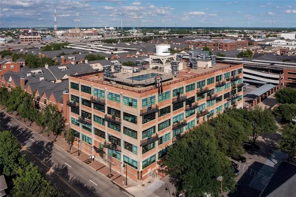 a view of a brick building with a street