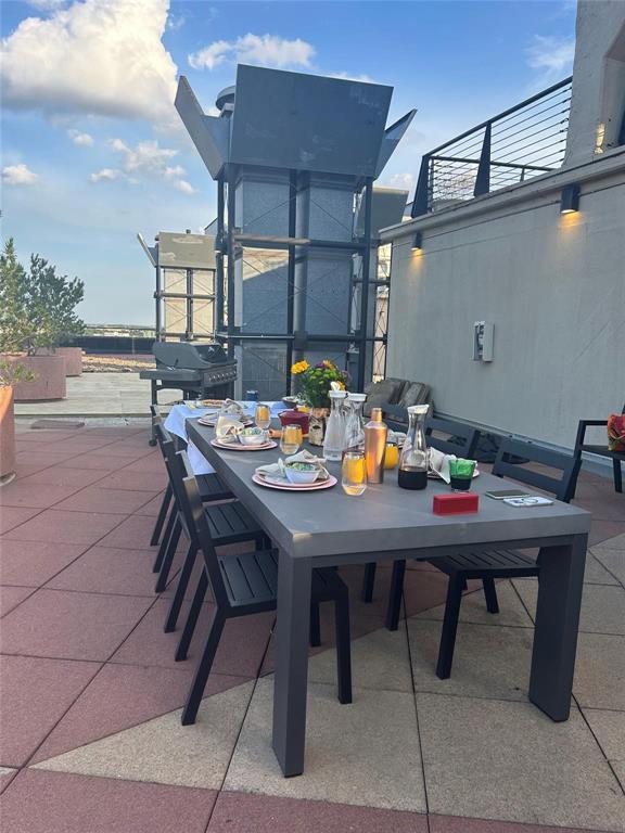 2220 Canton Street, Unit 406 Dallas, TX 75201 - Photo 19 of 22 a outdoor dining space with furniture and a potted plant