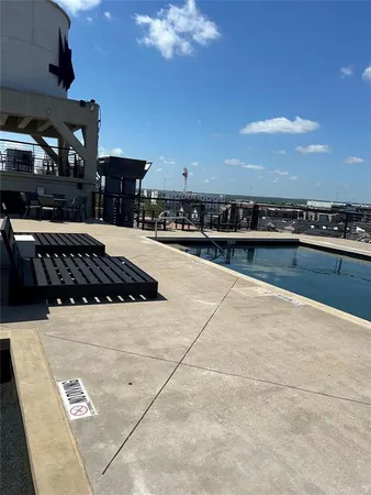 a view of a swimming pool with a yard