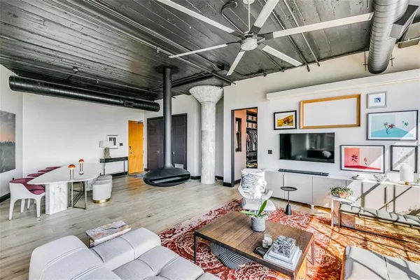a view of living room kitchen and entryway