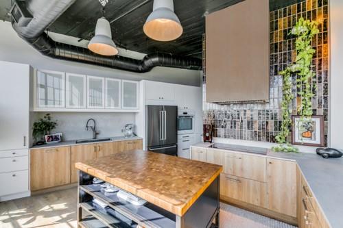 2220 Canton Street, Unit 406 Dallas, TX 75201 - Photo 8 of 22 a kitchen with a stove a refrigerator a sink and dishwasher with wooden floor