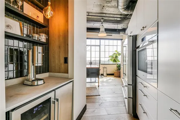 a bathroom with a granite countertop sink a mirror a vanity and a shower