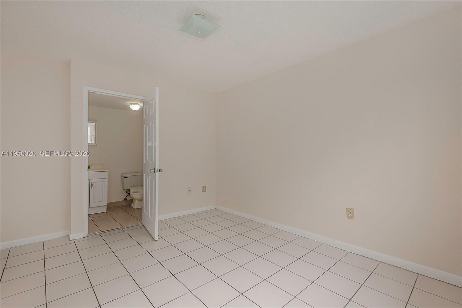7785 West 30th Court, Unit F104 Hialeah, FL 33018 - Photo 11 of 17 a view of an empty room and bathroom