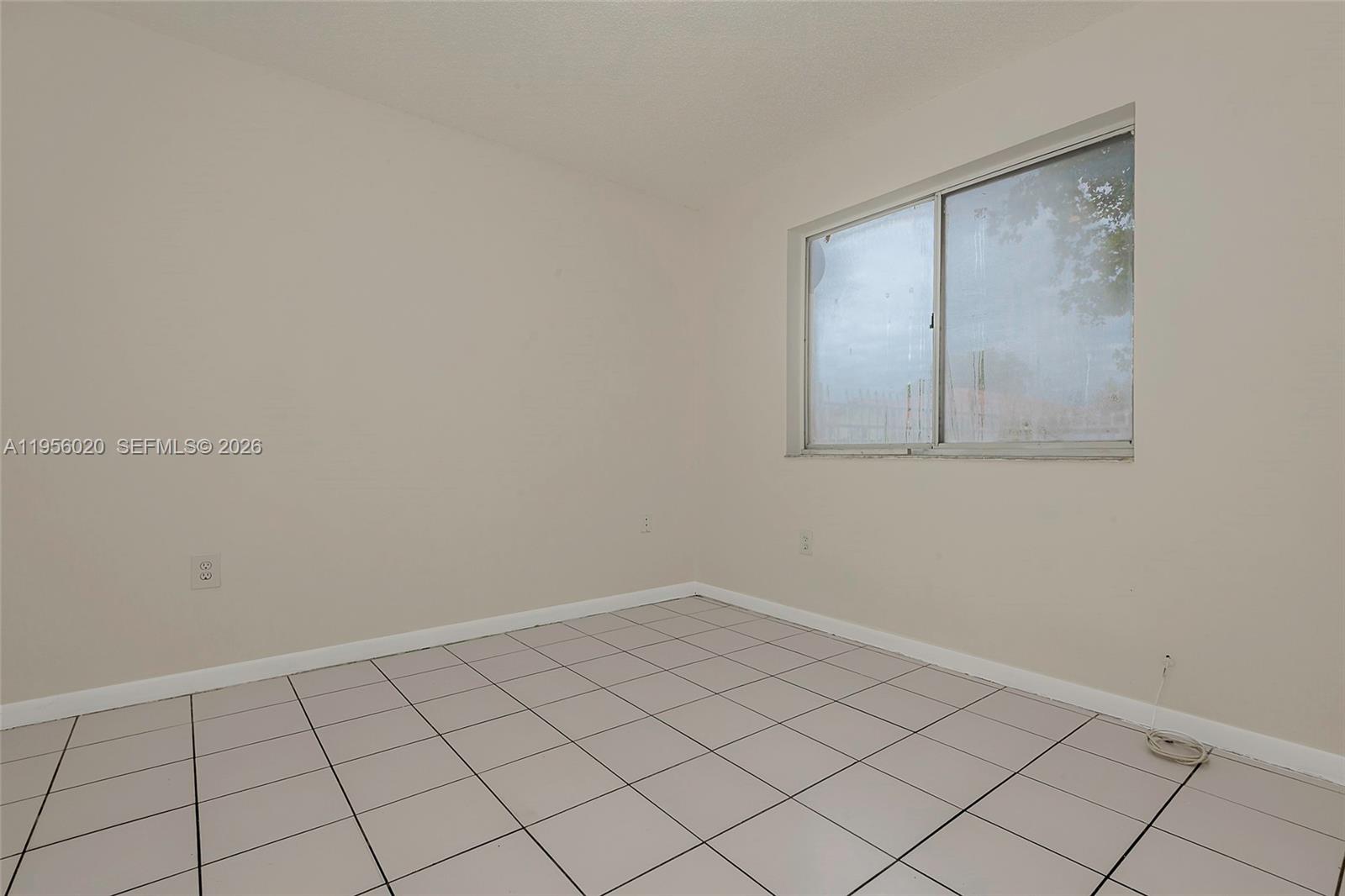 7785 West 30th Court, Unit F104 Hialeah, FL 33018 - Photo 15 of 17 a view of an empty room