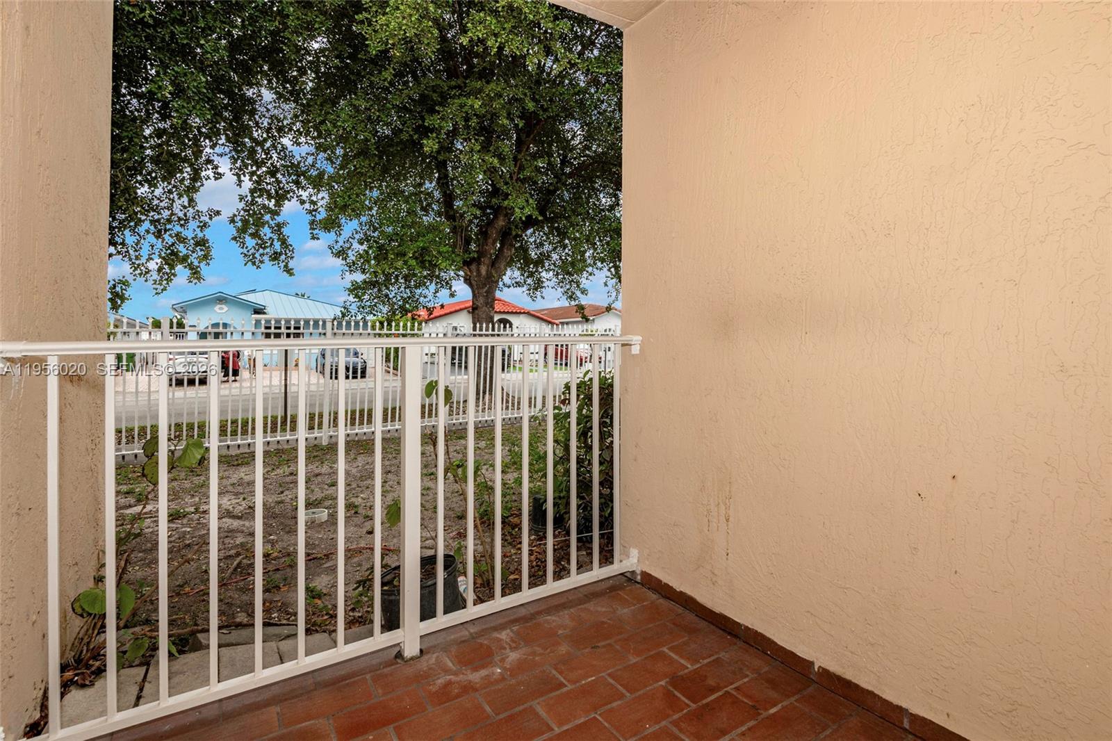 7785 West 30th Court, Unit F104 Hialeah, FL 33018 - Photo 5 of 17 a view of a balcony with an outdoor space