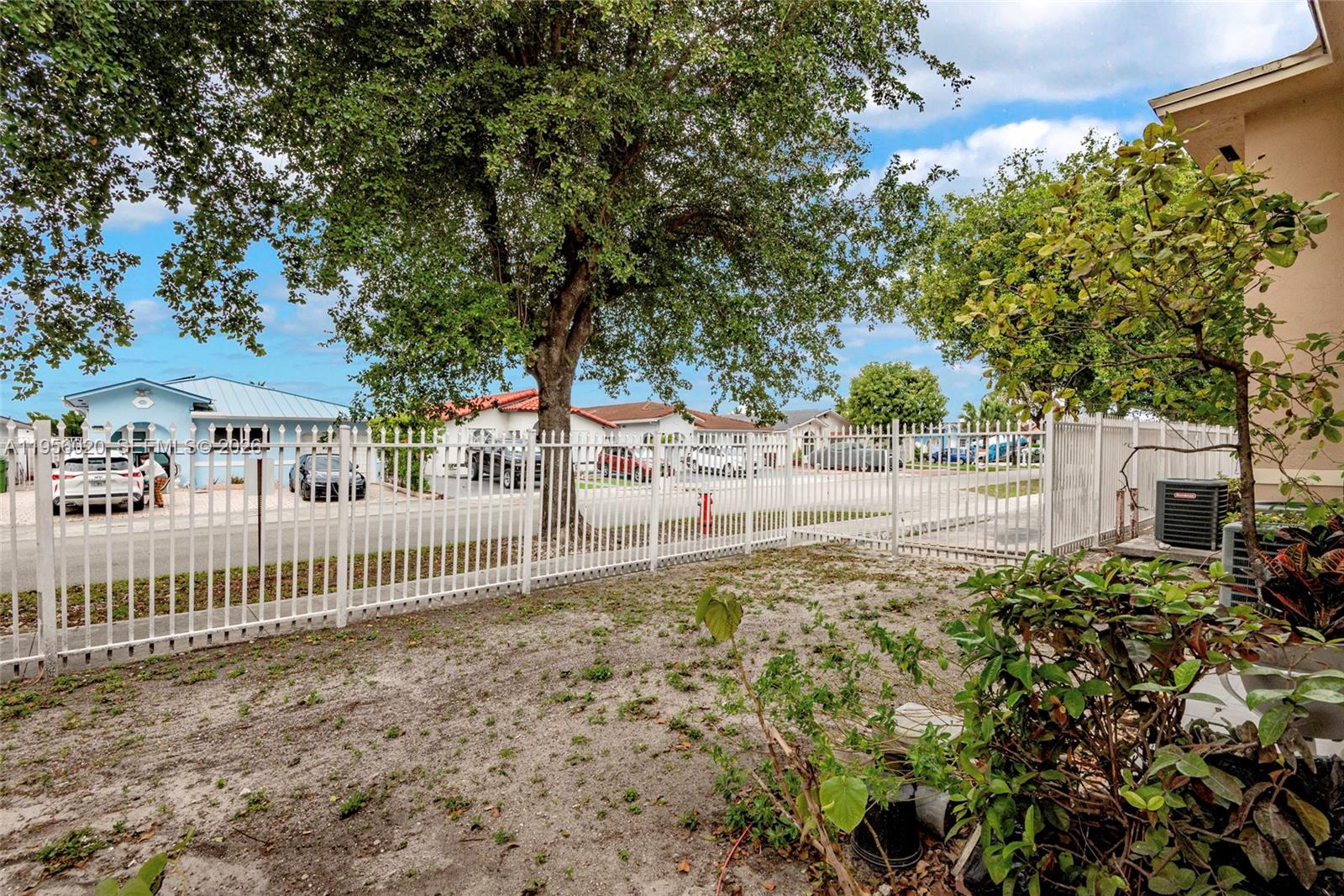 7785 West 30th Court, Unit F104 Hialeah, FL 33018 - Photo 6 of 17 a view of a yard with plants and trees