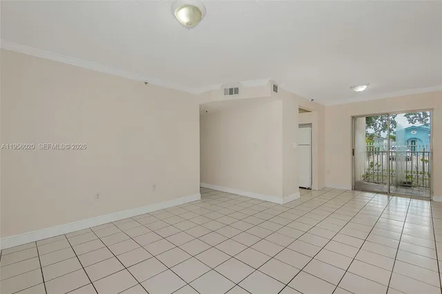 a view of an empty room and window