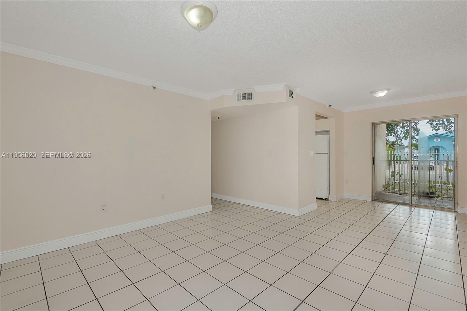 7785 West 30th Court, Unit F104 Hialeah, FL 33018 - Photo 9 of 17 a view of an empty room and window