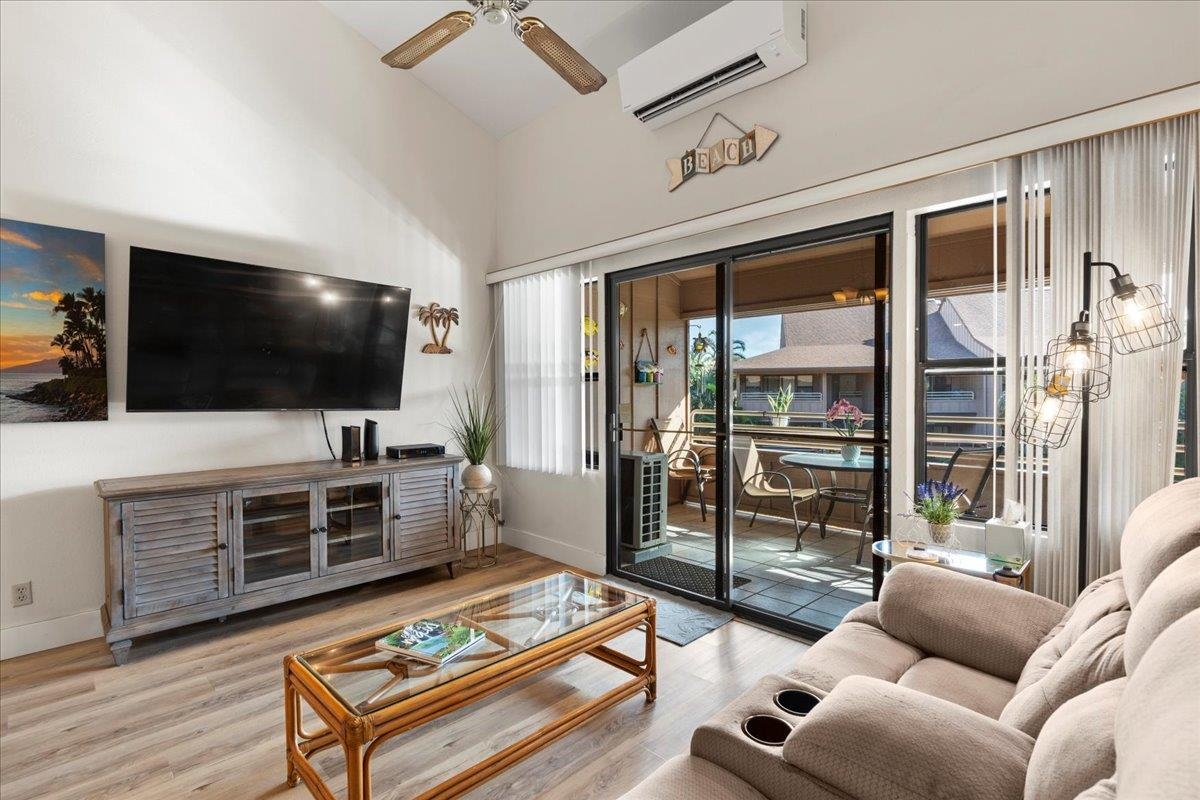 679 South Kihei Road, Unit D203 Kihei, HI 96753 - Photo 12 of 46 a living room with furniture and a flat screen tv