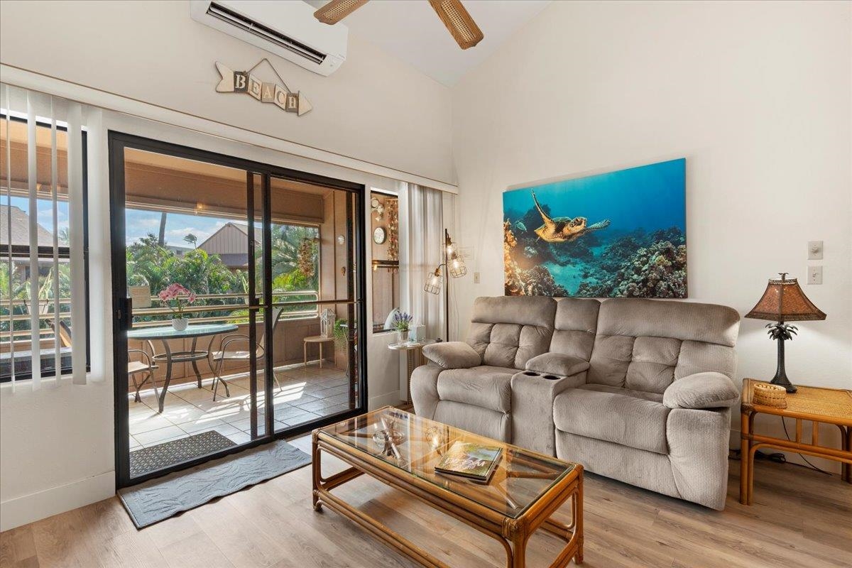 679 South Kihei Road, Unit D203 Kihei, HI 96753 - Photo 13 of 46 a living room with furniture and a floor to ceiling window