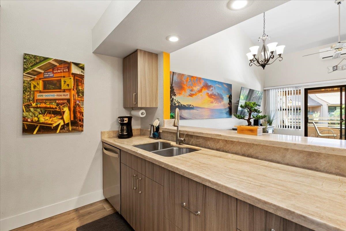679 South Kihei Road, Unit D203 Kihei, HI 96753 - Photo 21 of 46 a spacious bathroom with a granite countertop sink a large mirror and a window
