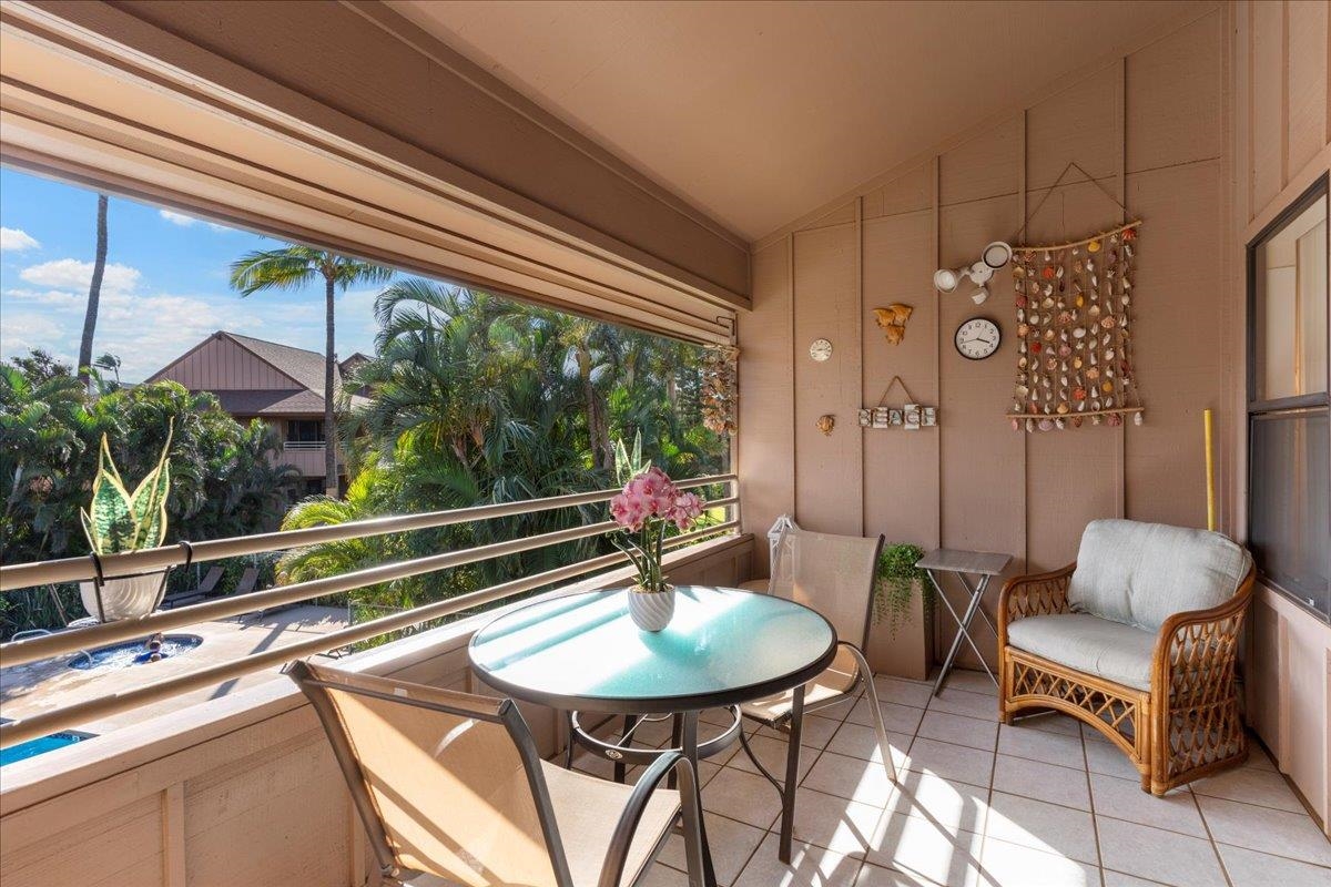 679 South Kihei Road, Unit D203 Kihei, HI 96753 - Photo 30 of 46 a room with furniture and a chandelier