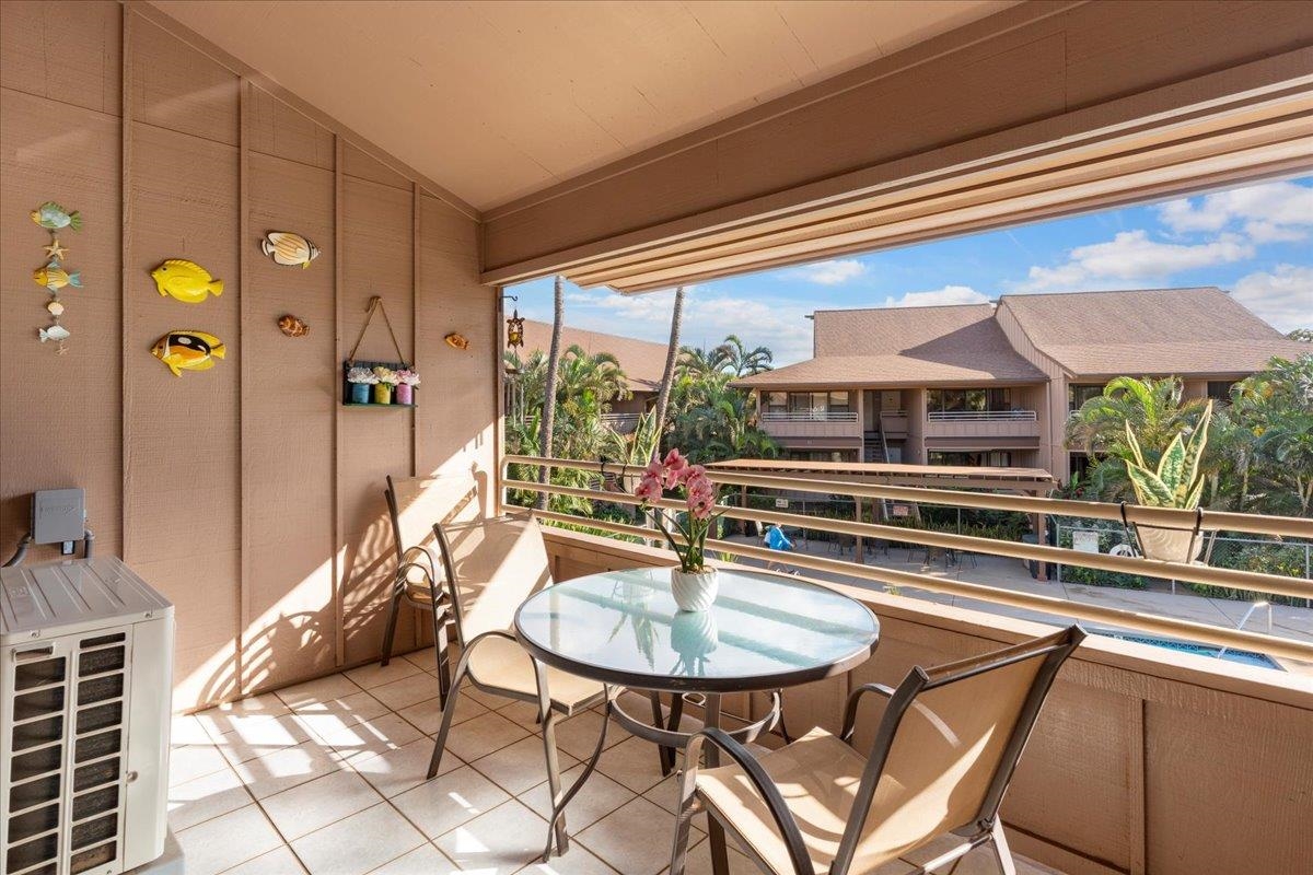 679 South Kihei Road, Unit D203 Kihei, HI 96753 - Photo 31 of 46 a dinning table and chairs in a balcony