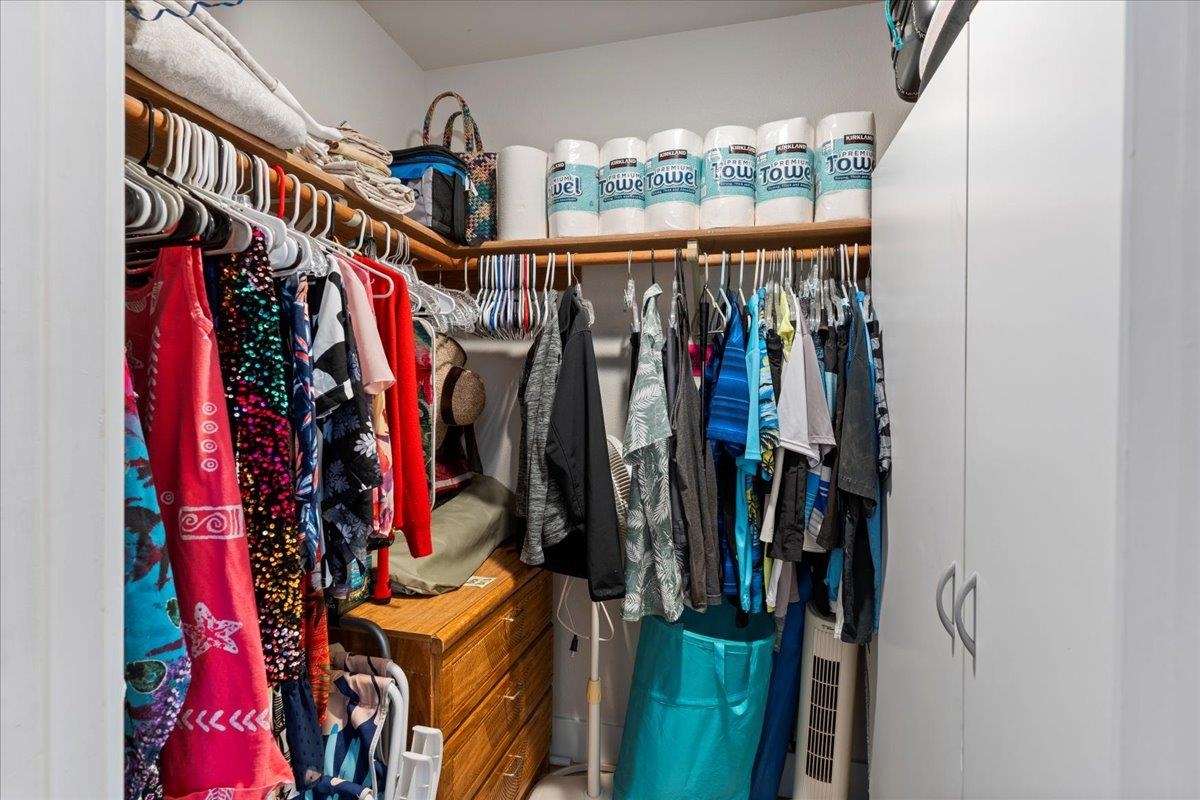 679 South Kihei Road, Unit D203 Kihei, HI 96753 - Photo 41 of 46 a view of walk in closet with clothes