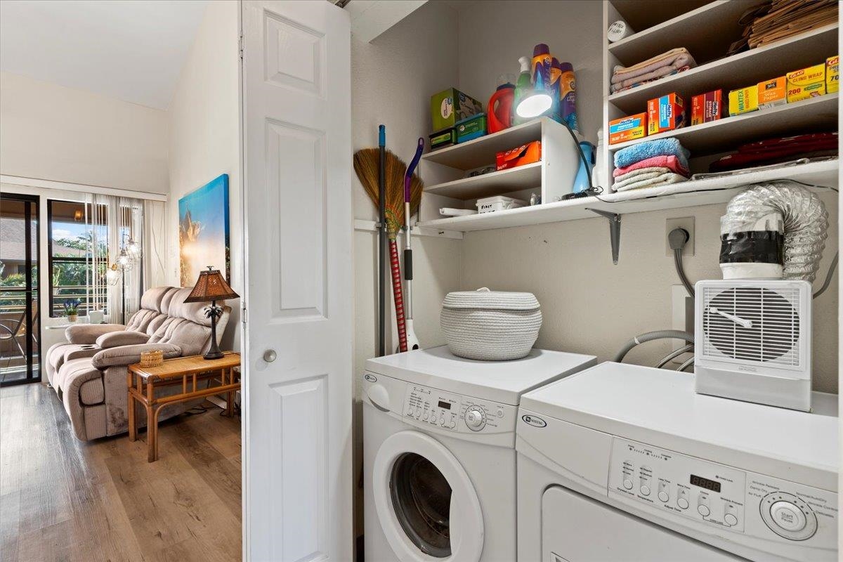 679 South Kihei Road, Unit D203 Kihei, HI 96753 - Photo 45 of 46 a utility room with dryer washer and a living room