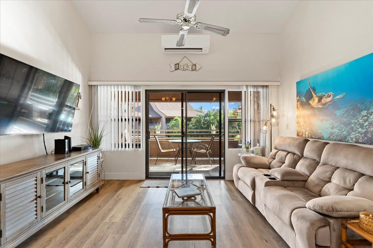679 South Kihei Road, Unit D203 Kihei, HI 96753 - Photo 10 of 46 a living room with furniture and a flat screen tv