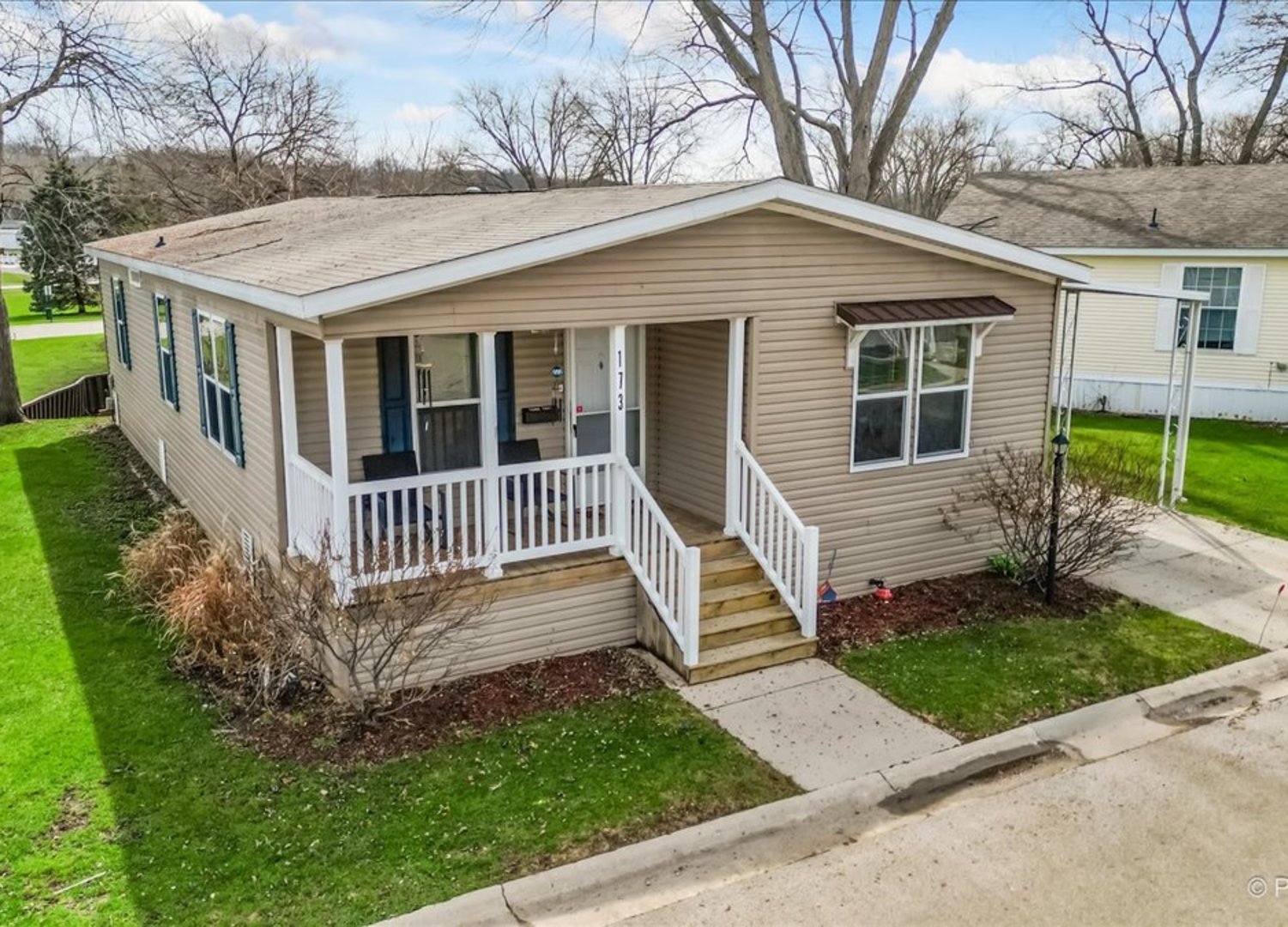 front view of a house with a yard