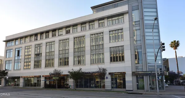 a front view of a building with glass windows