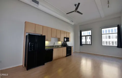 a kitchen with a refrigerator and a sink