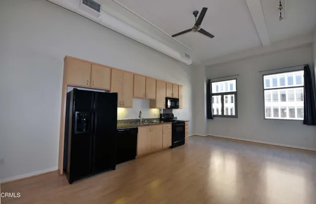 a kitchen with a refrigerator and a sink