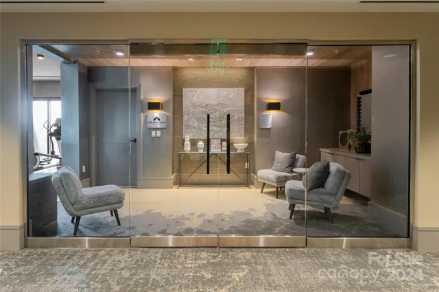 a living room with furniture and a rug