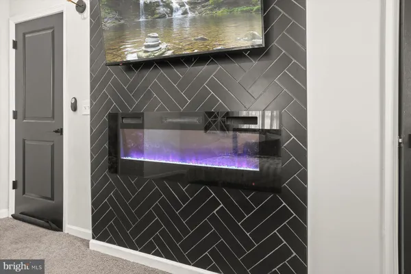 a bathroom with a double vanity sink mirror and bathtub