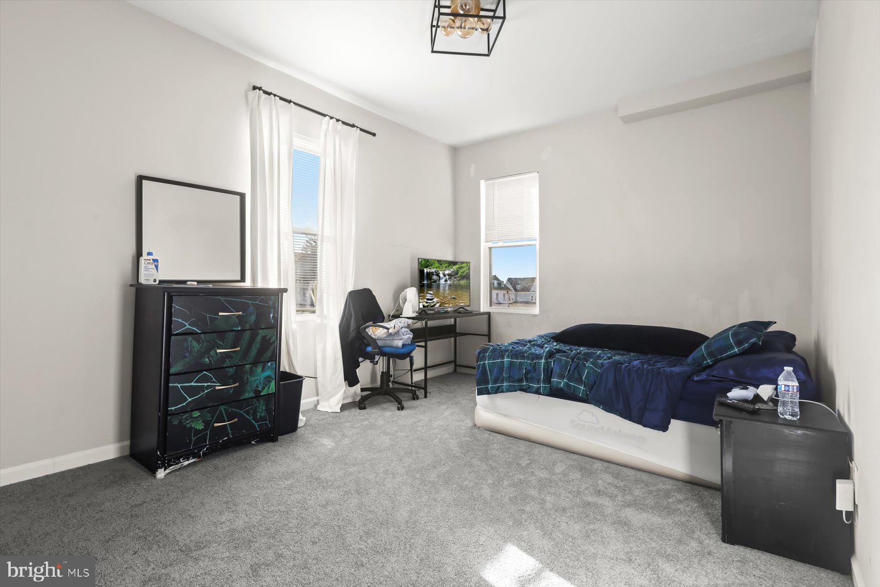 4006 Springdale Avenue Baltimore, MD 21207 - Photo 18 of 40 a living room with furniture and a window