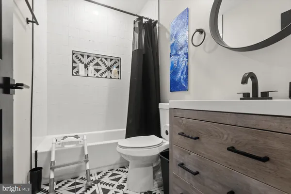 an empty room with a workbench and window