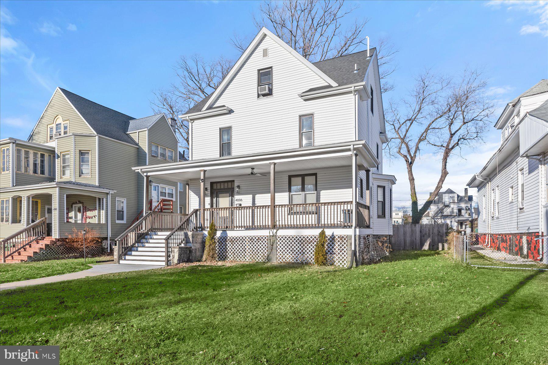 4006 Springdale Avenue Baltimore, MD 21207 - Photo 2 of 40 a front view of a house with a yard