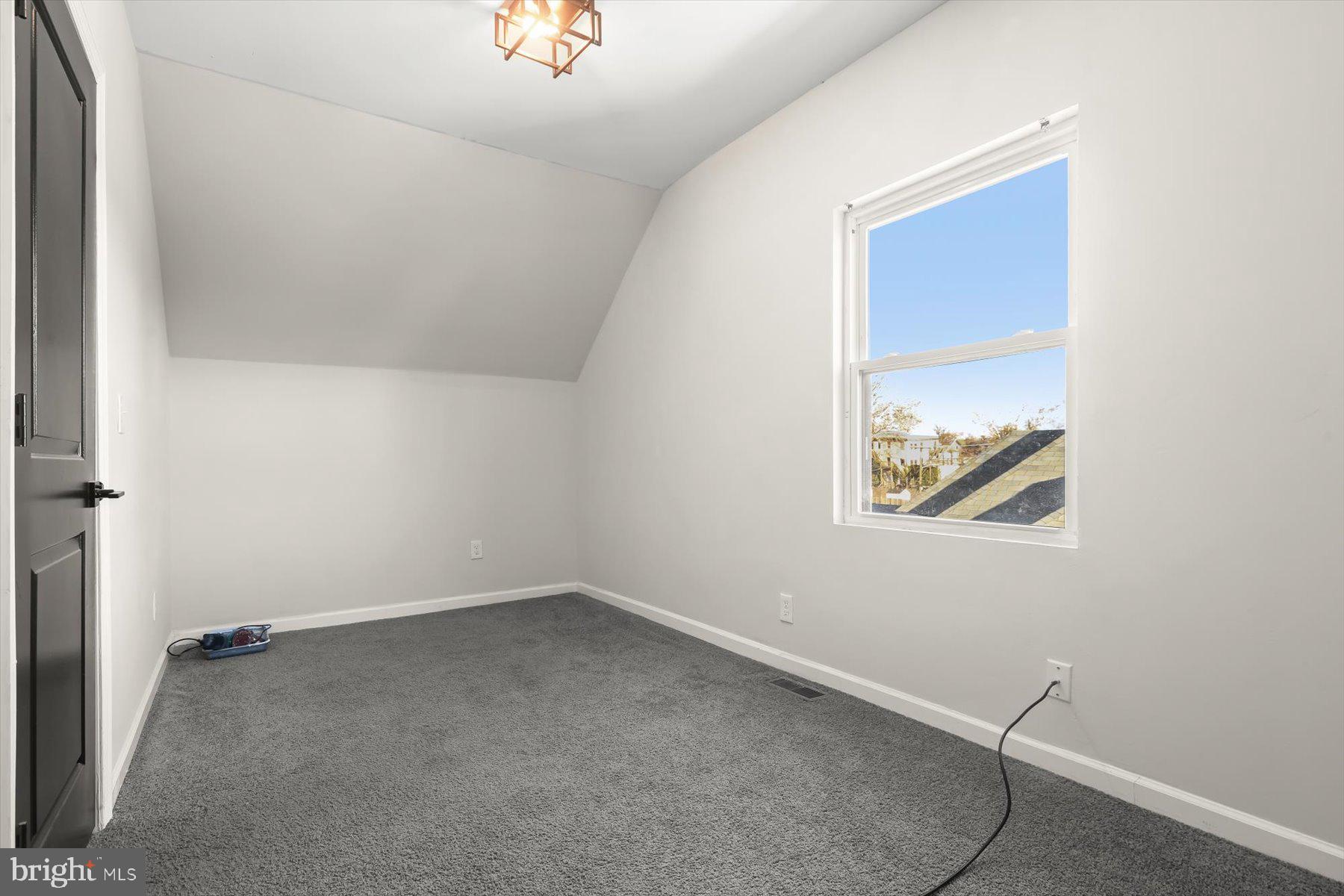 4006 Springdale Avenue Baltimore, MD 21207 - Photo 20 of 40 an empty room with a workbench and window