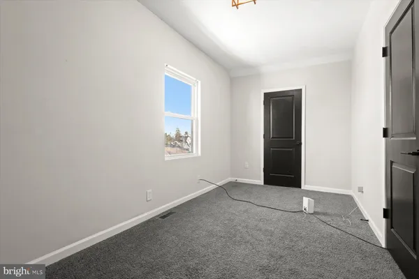 a bathroom with a toilet sink shower and mirror