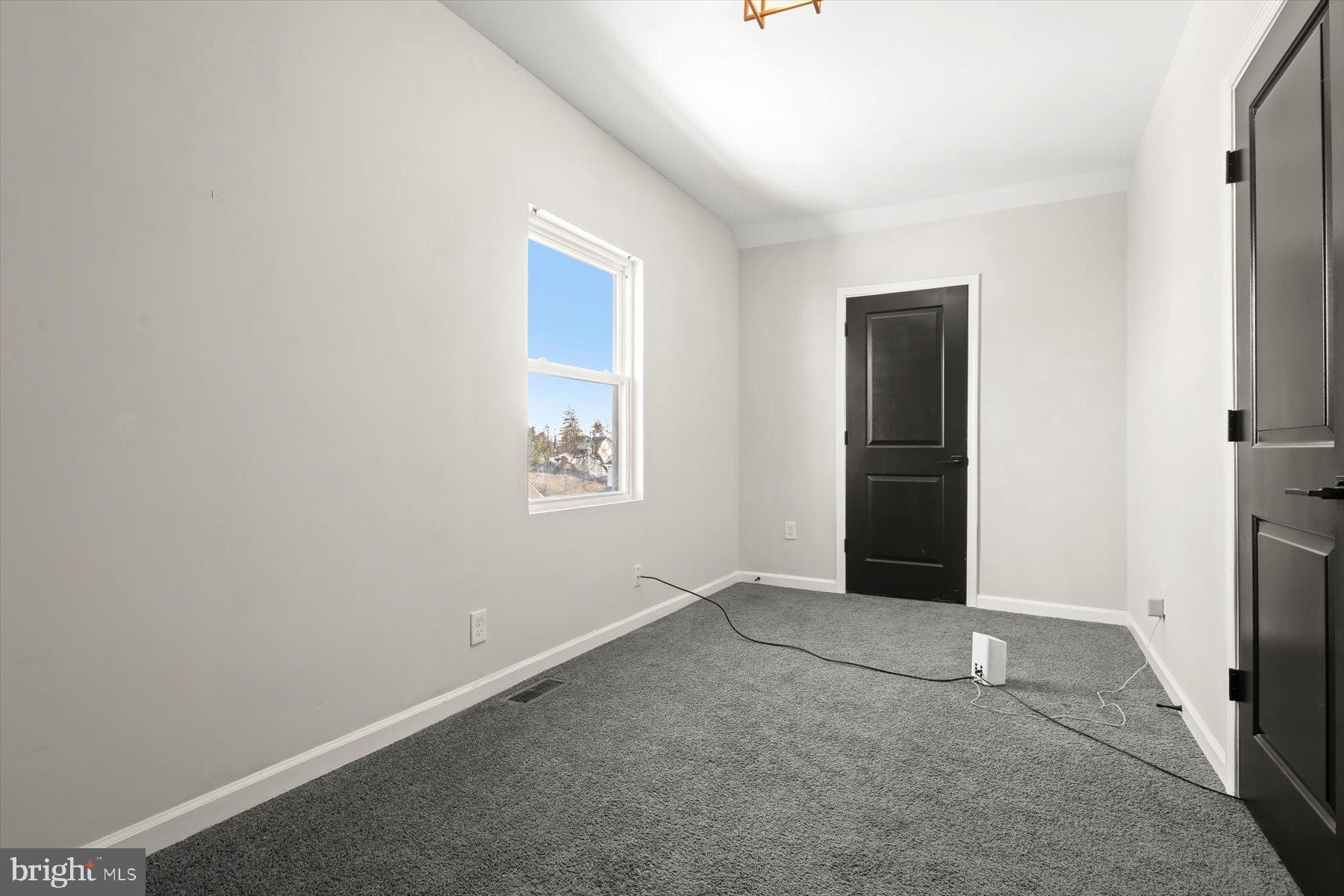 4006 Springdale Avenue Baltimore, MD 21207 - Photo 22 of 40 an empty room with windows