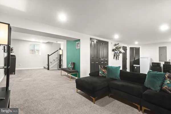 a view of a livingroom with furniture and a fireplace