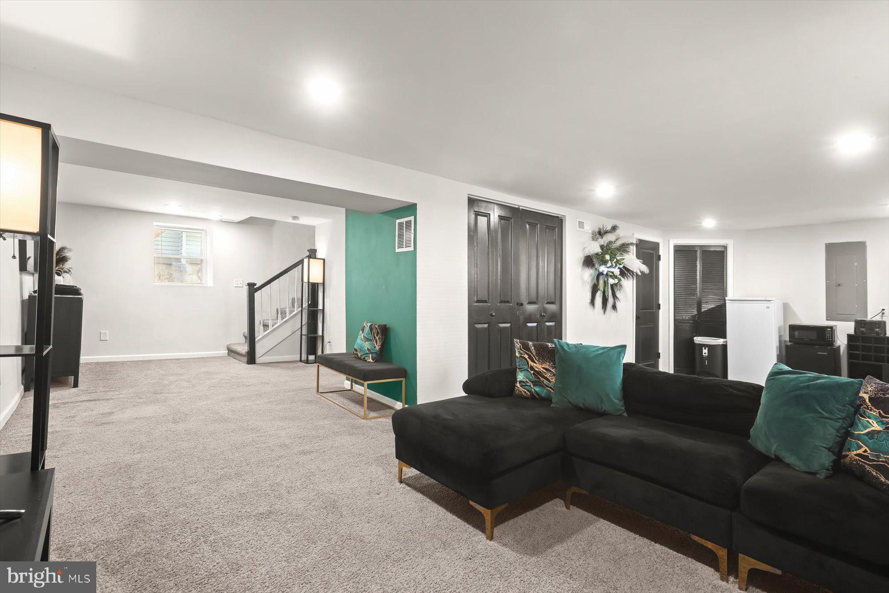 4006 Springdale Avenue Baltimore, MD 21207 - Photo 25 of 40 a living room with furniture and a ceiling fan