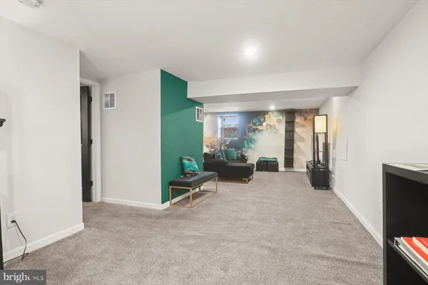 a bedroom with a bed and dresser