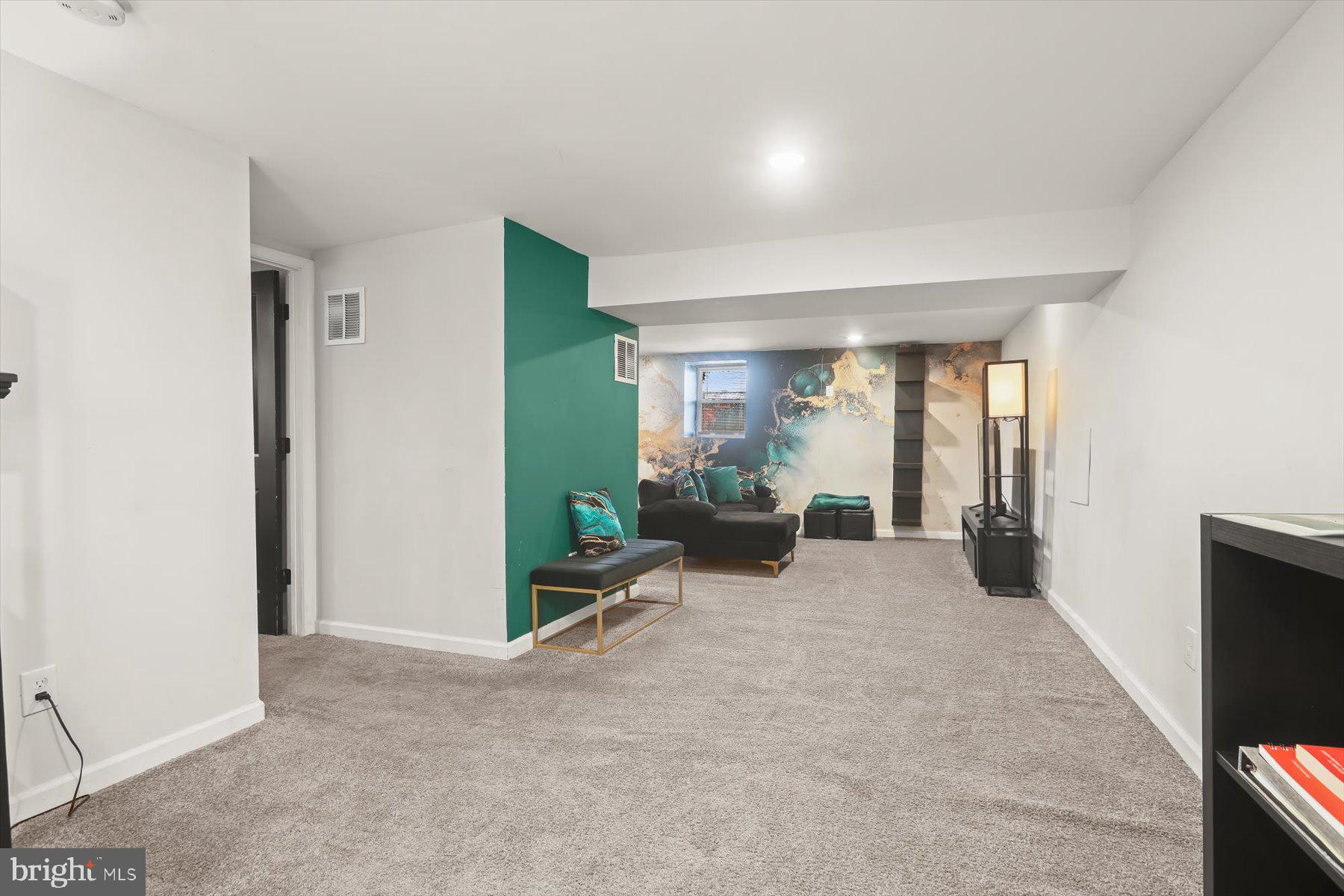 4006 Springdale Avenue Baltimore, MD 21207 - Photo 26 of 40 a view of a livingroom with furniture and a fireplace