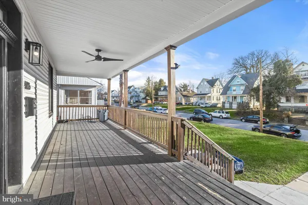a view of a balcony with wooden floor