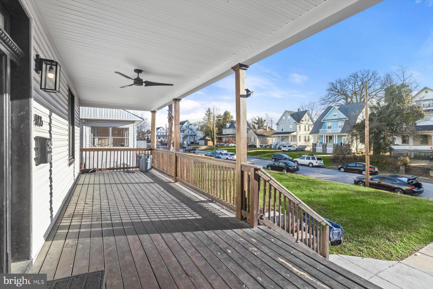 4006 Springdale Avenue Baltimore, MD 21207 - Photo 3 of 40 a view of a balcony with wooden floor