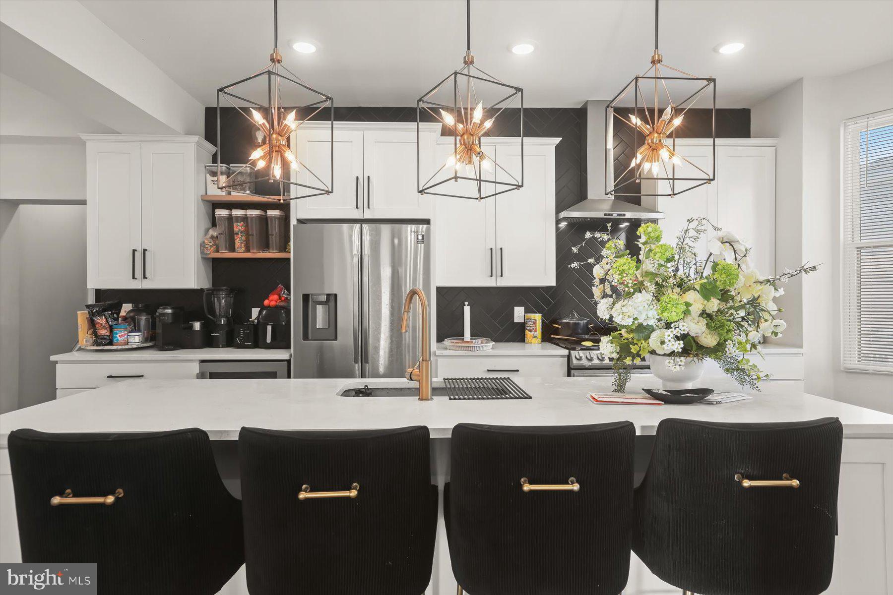4006 Springdale Avenue Baltimore, MD 21207 - Photo 7 of 40 a kitchen with a sink and refrigerator