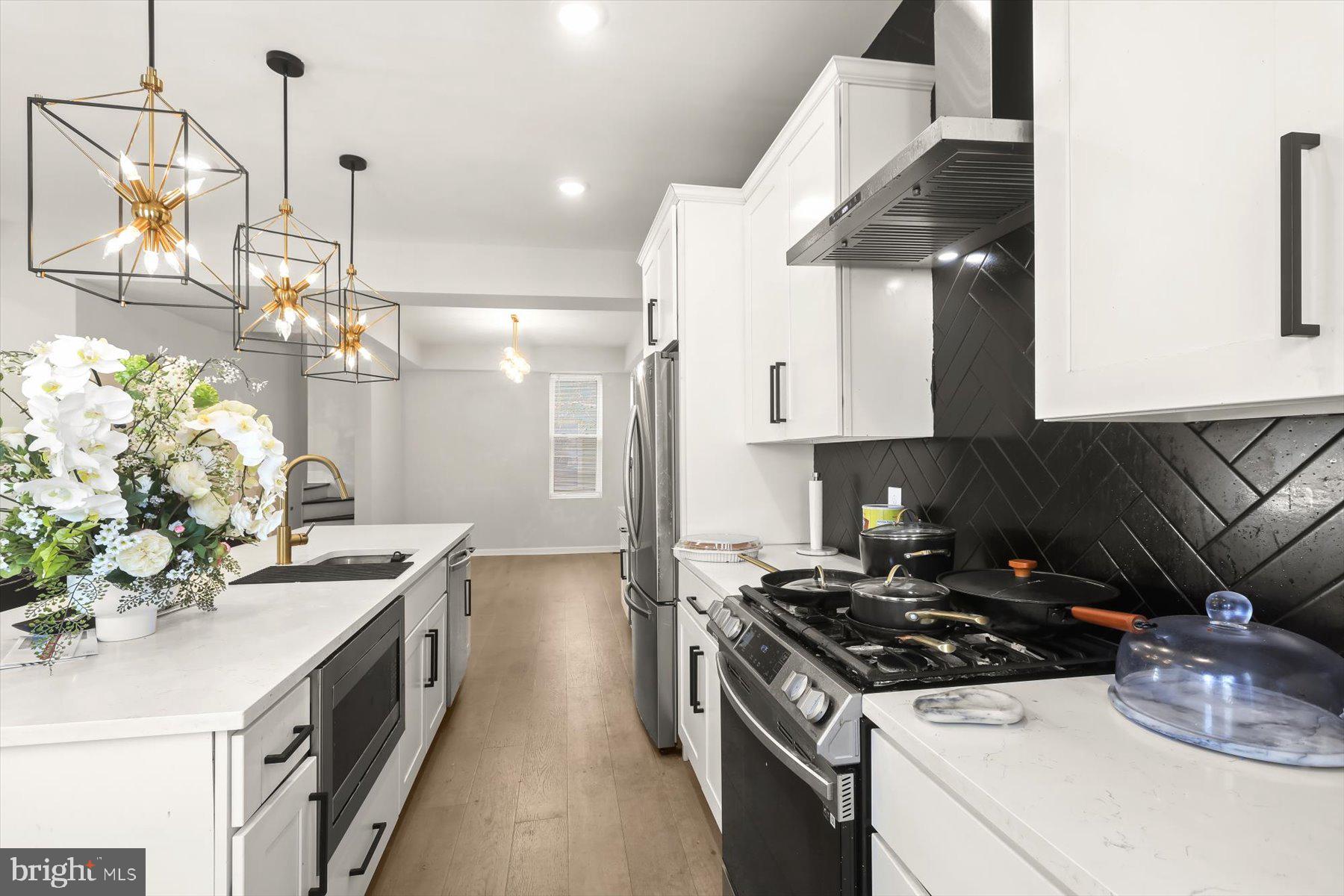 4006 Springdale Avenue Baltimore, MD 21207 - Photo 8 of 40 a kitchen with a stove and a sink