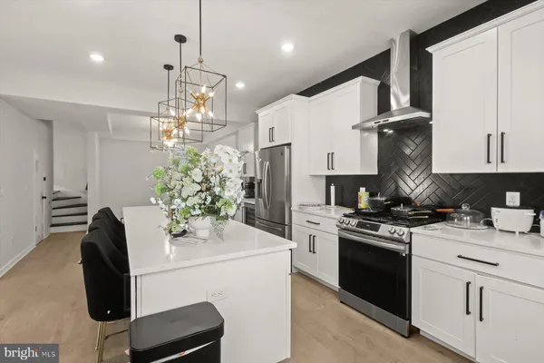 a kitchen with a stove and a sink