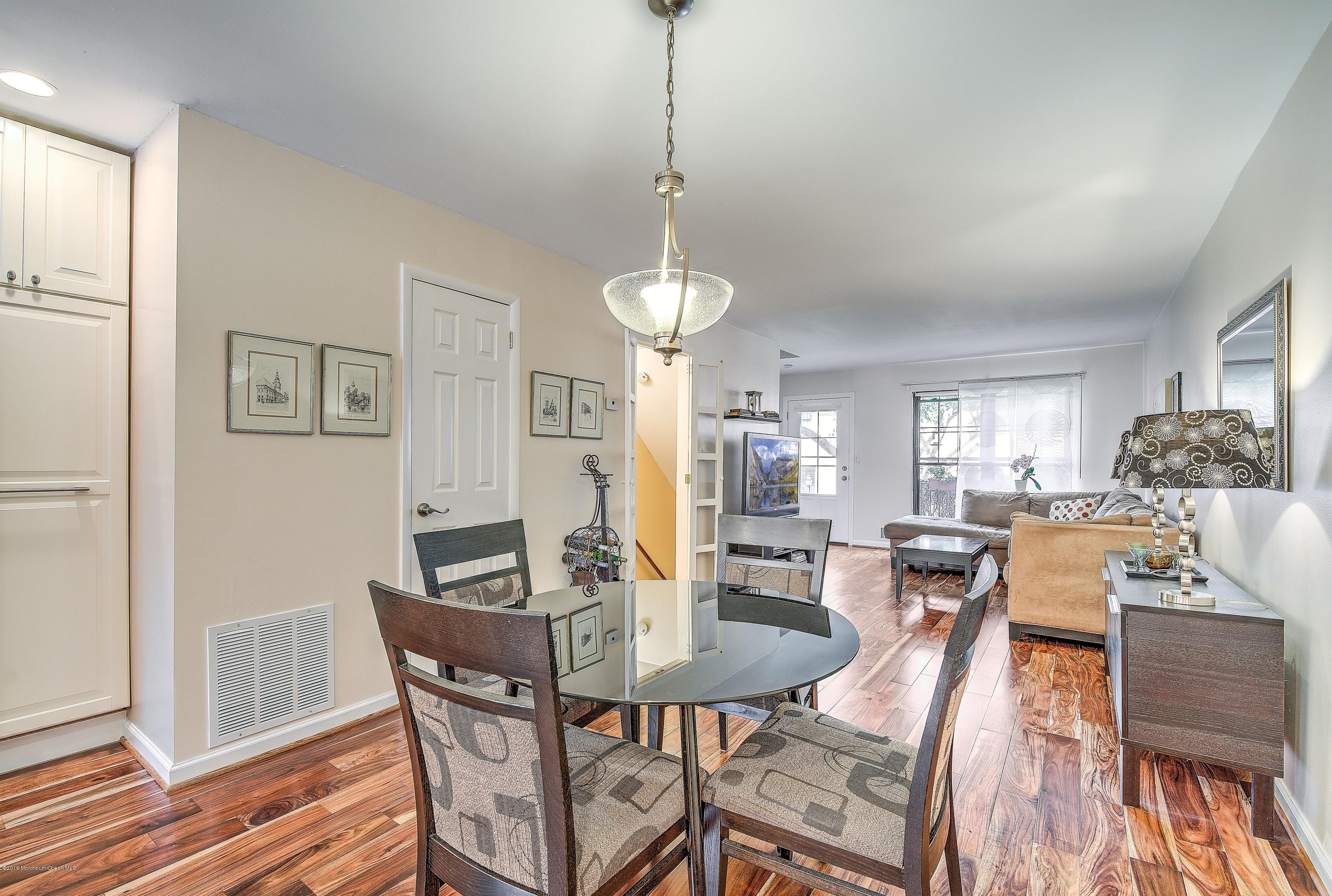321 Spring Street, Unit 12 Red Bank, NJ 07701 - Photo 8 of 24 a view of a dining room with furniture window and wooden floor