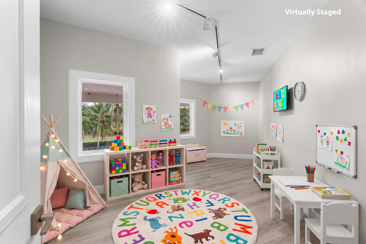 3500 Windmill Ranch Road Weston, FL 33331 - Photo 35 of 47 a room with furniture a baby crib and a wooden floor