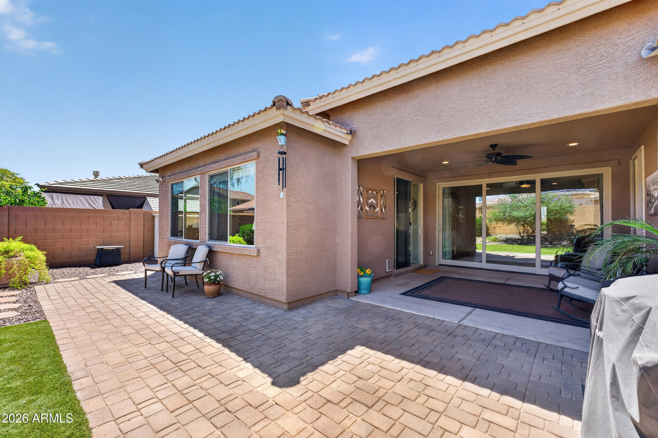 18612 West Mountain View Road Waddell, AZ 85355 - Photo 47 of 71 a view of a chair and tables in the patio