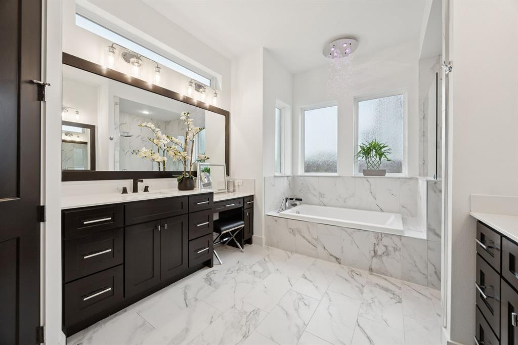7024 Prairie Ridge Road Argyle, TX 76226 - Photo 22 of 40 Spa-Inspired Bath with Stunning Marble-Look Flooring and Dual Sinks