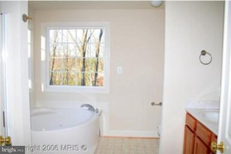 124 Holiday Road Cross Junction, VA 22625 - Photo 14 of 14 a bath tub sitting next to a window