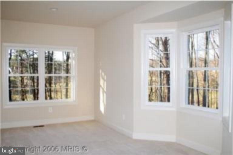 124 Holiday Road Cross Junction, VA 22625 - Photo 7 of 14 a view of an empty room with a window