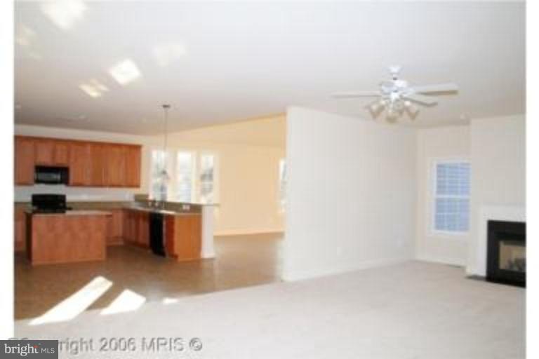 124 Holiday Road Cross Junction, VA 22625 - Photo 8 of 14 a view of kitchen with furniture and a ceiling fan