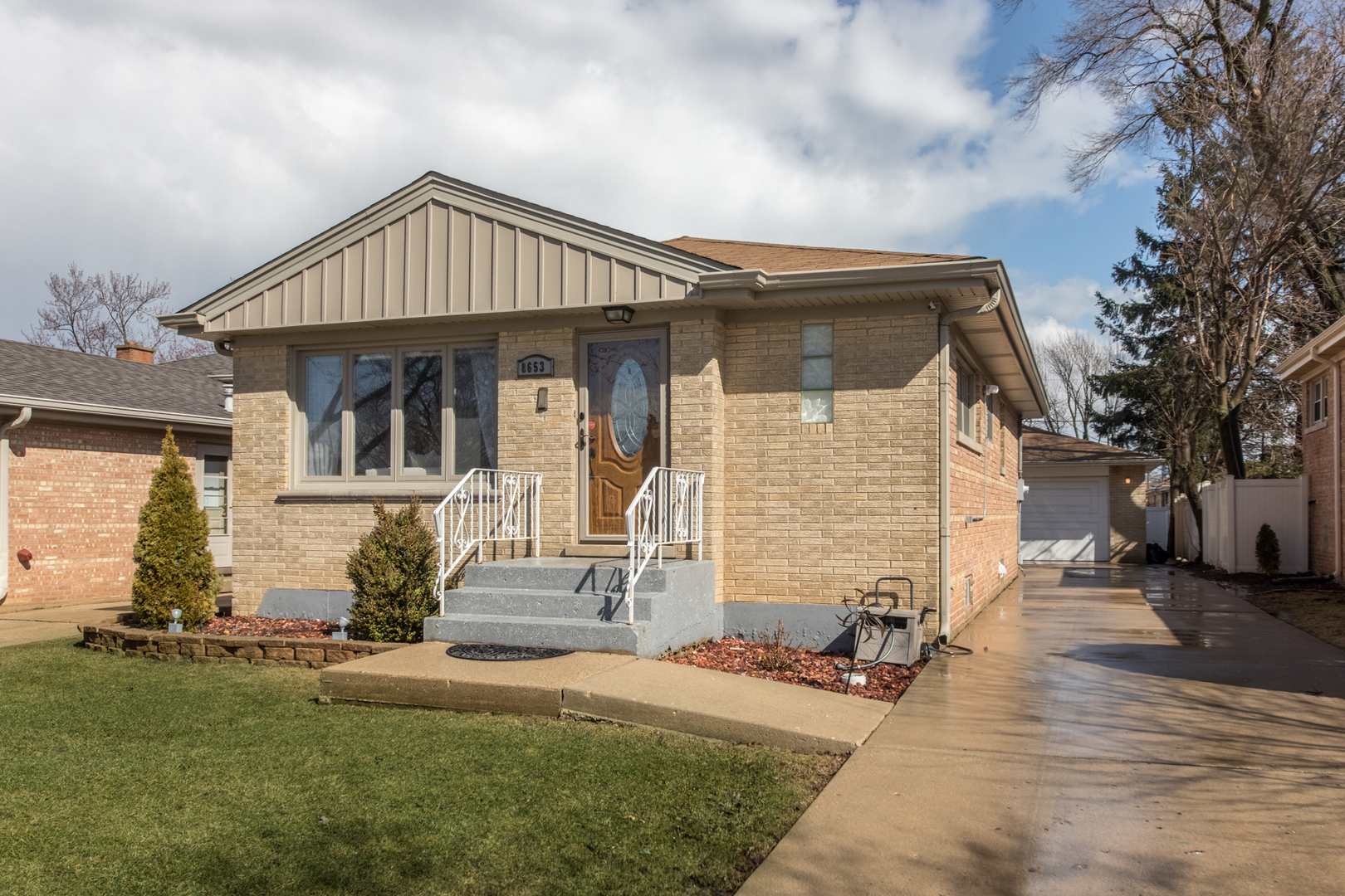8653 North Merrill Street Niles, IL 60714 - Photo 2 of 19 a front view of a house with a yard