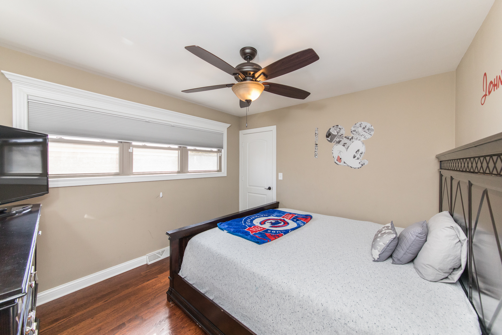 8653 North Merrill Street Niles, IL 60714 - Photo 12 of 19 a bedroom with a bed and a chandelier